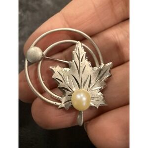 Vintage Georg Jensen sterling silver brooch with a "STER" hallmark